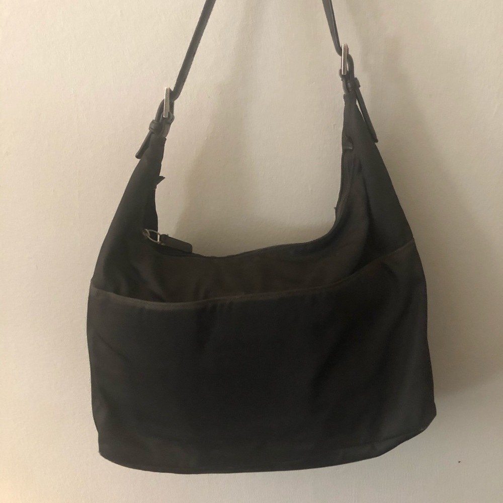 Vintage Coach shoulder bag. There are no tears or rips.  A bit of wear on seams